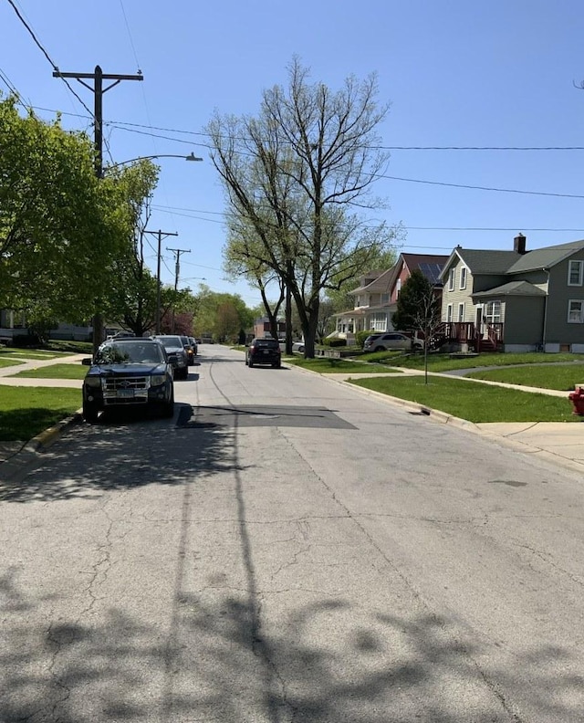 523 Edwards St, Aurora, IL 60505 - view of asphalt street featuring sidewalks, curbs, and a residential view