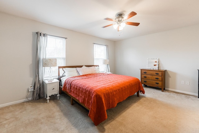722 Amherst Dr, Sycamore, IL 60178 - bedroom with light colored carpet, baseboards, and ceiling fan