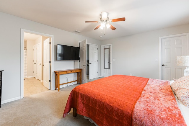 722 Amherst Dr, Sycamore, IL 60178 - bedroom with light colored carpet, baseboards, a ceiling fan, and ensuite bathroom
