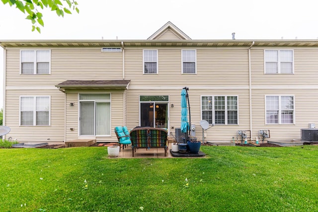722 Amherst Dr, Sycamore, IL 60178 - rear view of house with a lawn, central air condition unit, and a patio