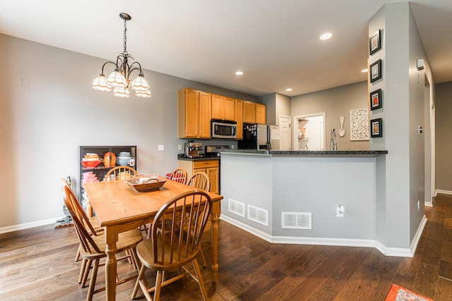 722 Amherst Dr, Sycamore, IL 60178 - dining room featuring baseboards, wood finished floors, recessed lighting, and a chandelier