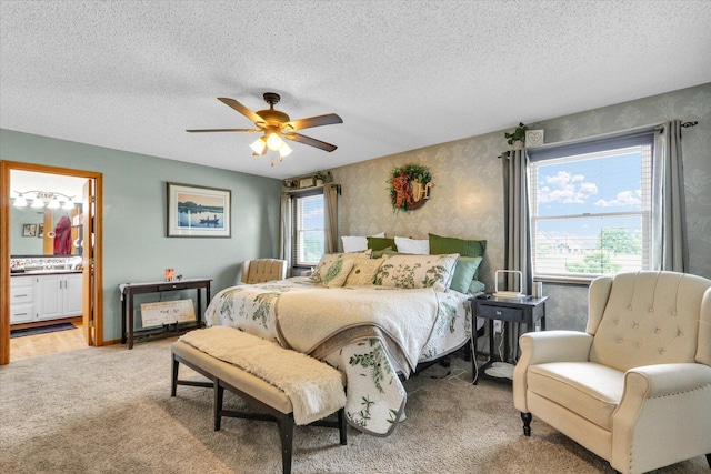 705 Northridge Dr, Mahomet, IL 61853 - bedroom featuring light carpet, a textured ceiling, a ceiling fan, and ensuite bath