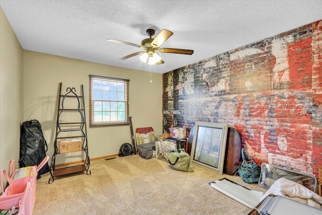 705 Northridge Dr, Mahomet, IL 61853 - playroom with carpet flooring, ceiling fan, and a textured ceiling