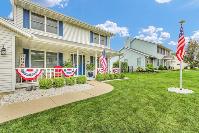 705 Northridge Dr, Mahomet, IL 61853 - view of front of house featuring a porch and a front lawn
