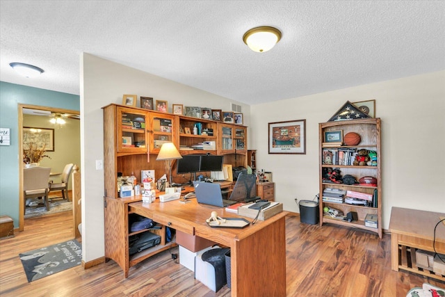 705 Northridge Dr, Mahomet, IL 61853 - office featuring wood finished floors, a textured ceiling, a ceiling fan, and lofted ceiling