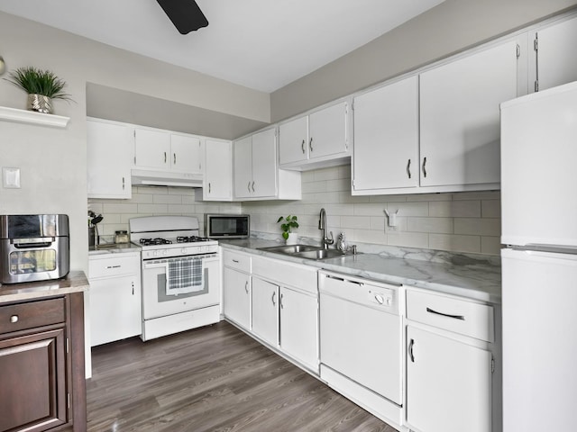 1094 Rainwood Dr, Aurora, IL 60506 - kitchen with white appliances, a sink, under cabinet range hood, backsplash, and white cabinetry