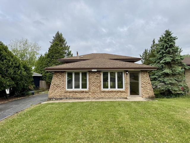 16104 Oak Ave, Oak Forest, IL 60452 - rear view of property with brick siding, a lawn, and roof with shingles