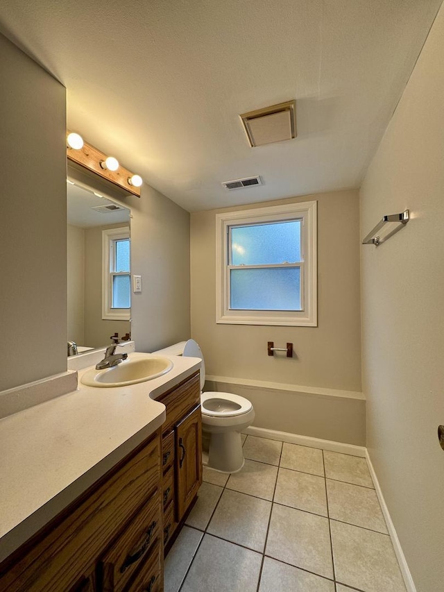16104 Oak Ave, Oak Forest, IL 60452 - bathroom featuring toilet, vanity, tile patterned flooring, and baseboards