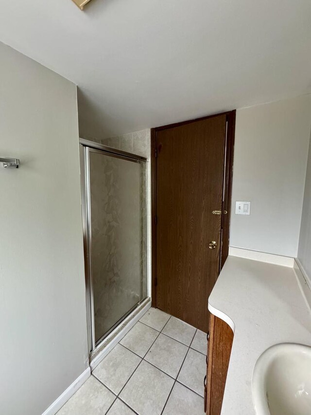 16104 Oak Ave, Oak Forest, IL 60452 - bathroom featuring a shower stall, vanity, and tile patterned flooring