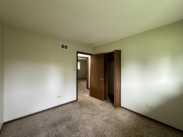 16104 Oak Ave, Oak Forest, IL 60452 - unfurnished bedroom with light colored carpet and baseboards