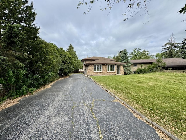 16104 Oak Ave, Oak Forest, IL 60452 - view of front of property with a front lawn, asphalt driveway, and brick siding