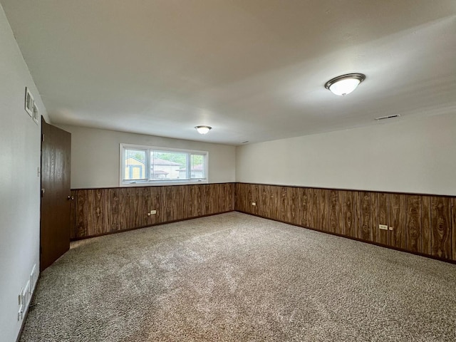16104 Oak Ave, Oak Forest, IL 60452 - carpeted empty room with wainscoting and wood walls