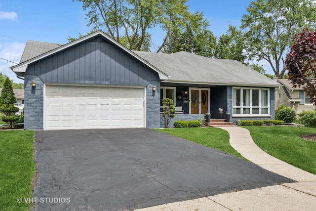1140 Catalpa Ln, Naperville, IL 60540 - ranch-style house with a garage, asphalt driveway, a front yard, a shingled roof, and a porch