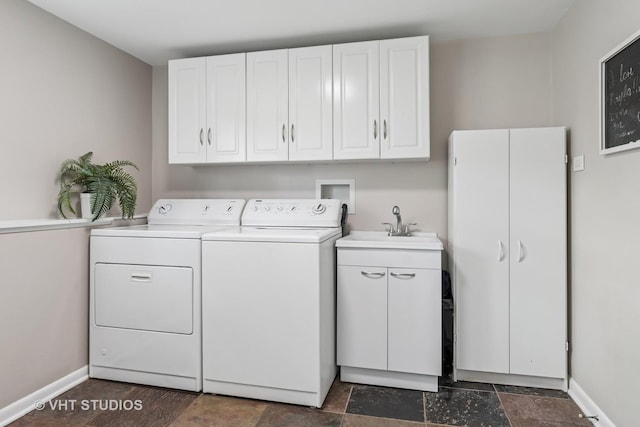 1140 Catalpa Ln, Naperville, IL 60540 - washroom featuring washer and clothes dryer, cabinet space, baseboards, and dark stone finish flooring