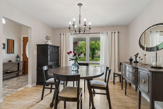 1140 Catalpa Ln, Naperville, IL 60540 - dining room with light wood-type flooring and a chandelier