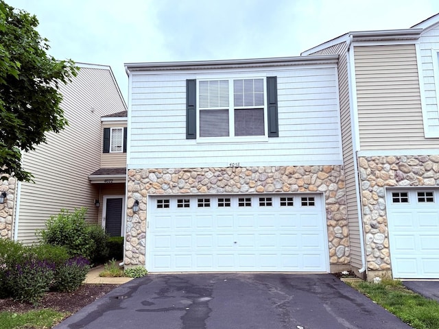 4078 Boulder Ct, Aurora, IL 60504 - multi unit property featuring stone siding, asphalt driveway, and a garage