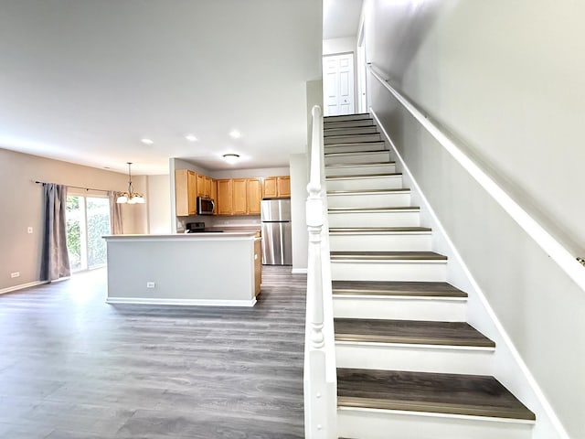4078 Boulder Ct, Aurora, IL 60504 - stairs with wood finished floors, baseboards, recessed lighting, and a chandelier
