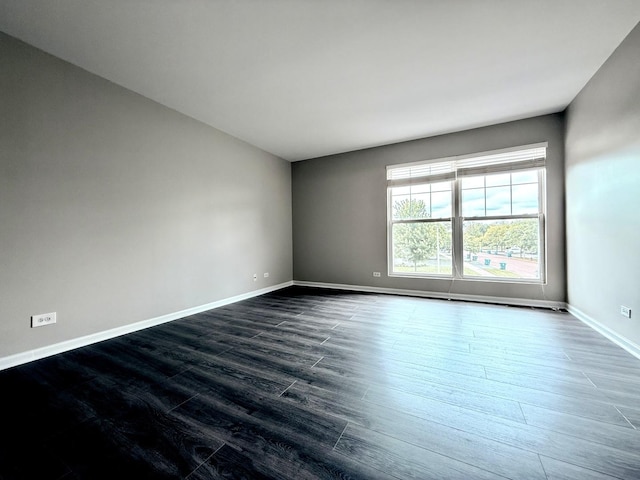 4078 Boulder Ct, Aurora, IL 60504 - unfurnished room featuring baseboards and dark wood-style floors