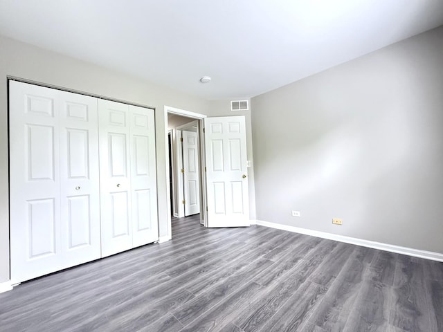 4078 Boulder Ct, Aurora, IL 60504 - unfurnished bedroom with wood finished floors, baseboards, and a closet