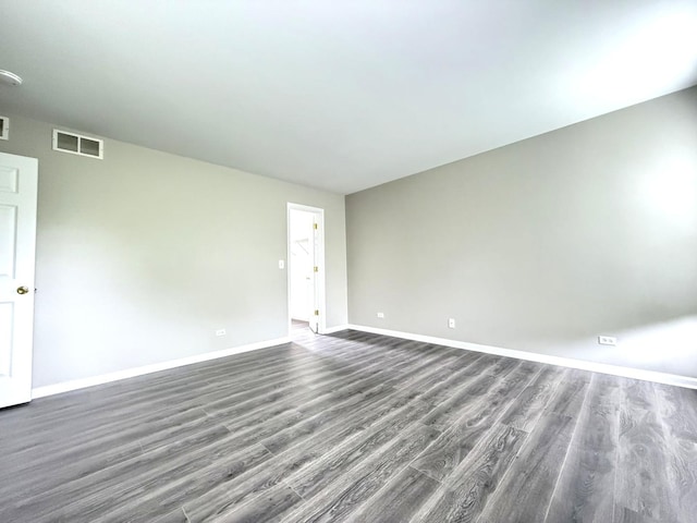 4078 Boulder Ct, Aurora, IL 60504 - empty room with dark wood-style flooring, baseboards, and a smoke detector