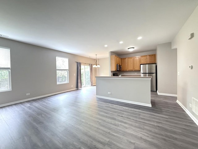 4078 Boulder Ct, Aurora, IL 60504 - kitchen with stainless steel appliances, a chandelier, recessed lighting, open floor plan, and dark wood-type flooring