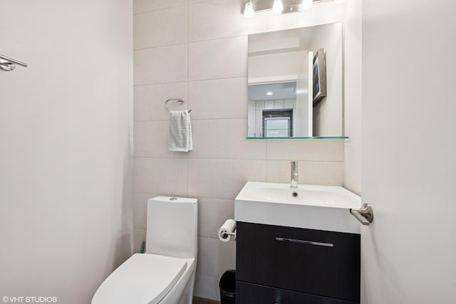 3019 N Allen Ave, Chicago, IL 60618 - half bathroom with tile walls, toilet, and vanity