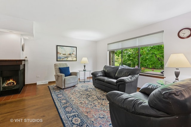 1809 Grant St, Evanston, IL 60201 - living room featuring wood finished floors, a fireplace with flush hearth, and baseboards