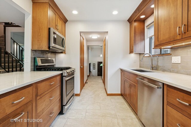 1809 Grant St, Evanston, IL 60201 - kitchen with stainless steel appliances, a sink, healthy amount of natural light, light countertops, and recessed lighting