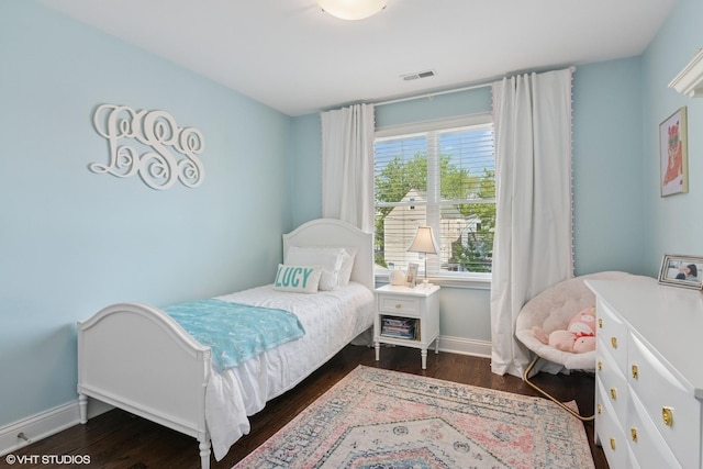 2450 W Warner Ave, Chicago, IL 60618 - bedroom featuring baseboards and dark wood finished floors