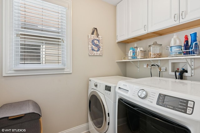 2450 W Warner Ave, Chicago, IL 60618 - washroom with independent washer and dryer, cabinet space, and baseboards