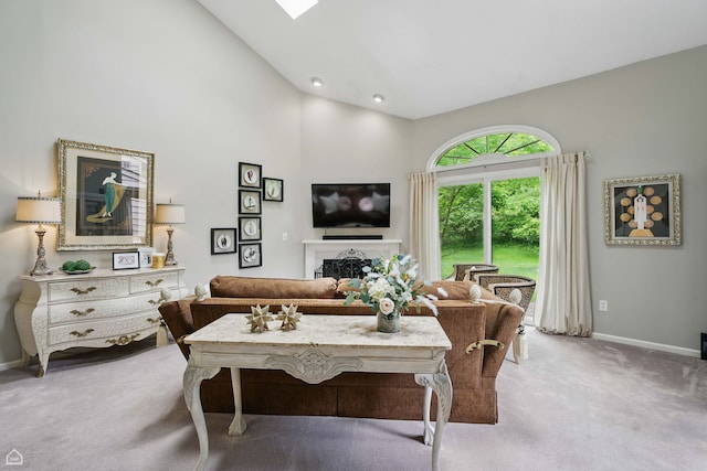 36 Lakewood Cir, Saint Charles, IL 60174 - carpeted living room featuring high vaulted ceiling, baseboards, and a fireplace