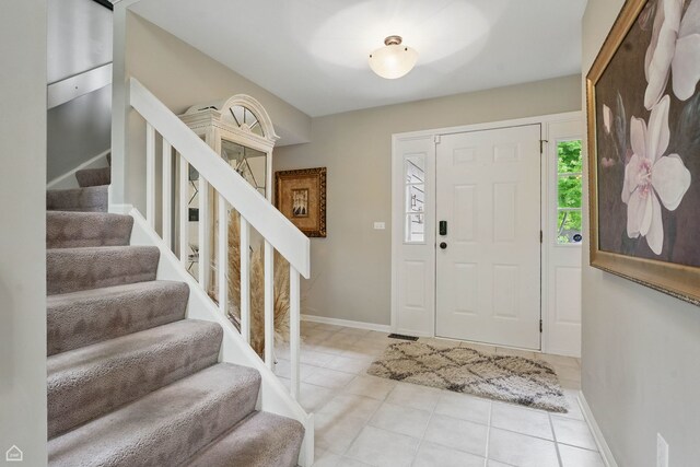 36 Lakewood Cir, Saint Charles, IL 60174 - foyer entrance featuring stairway, tile patterned floors, and baseboards