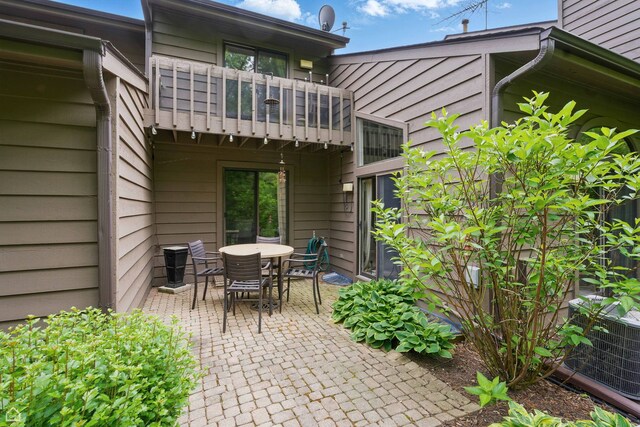 36 Lakewood Cir, Saint Charles, IL 60174 - view of patio featuring a balcony, cooling unit, and outdoor dining area