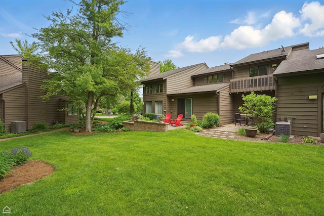 36 Lakewood Cir, Saint Charles, IL 60174 - view of green lawn featuring central air condition unit, a balcony, and a patio