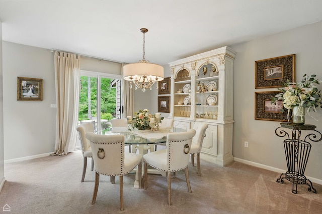 36 Lakewood Cir, Saint Charles, IL 60174 - dining room featuring a chandelier, light colored carpet, and baseboards