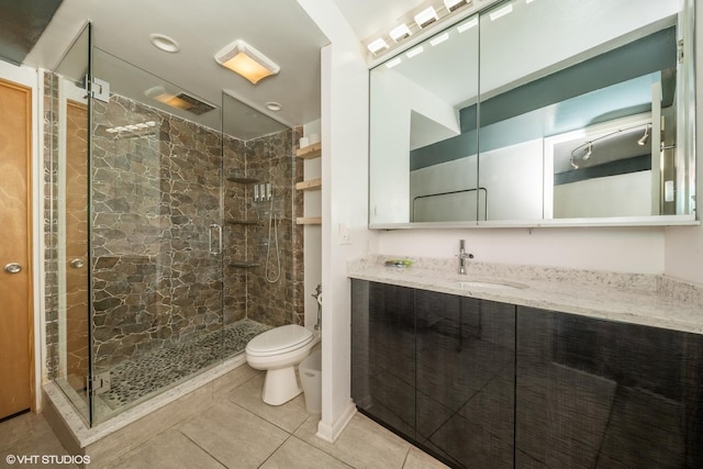 300 N State St Unit 5503, Chicago, IL 60654 - bathroom featuring a stall shower, toilet, tile patterned flooring, and vanity