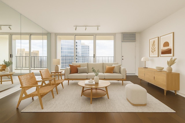 300 N State St Unit 5503, Chicago, IL 60654 - living room with rail lighting, dark wood finished floors, healthy amount of natural light, and expansive windows