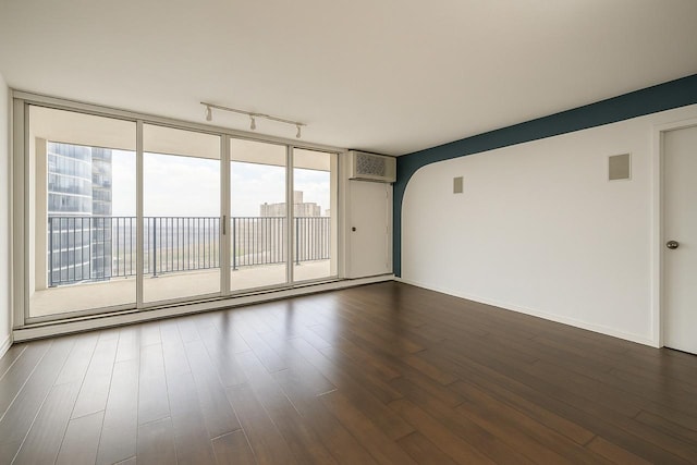 300 N State St Unit 5503, Chicago, IL 60654 - empty room featuring dark wood-style floors, baseboards, and arched walkways