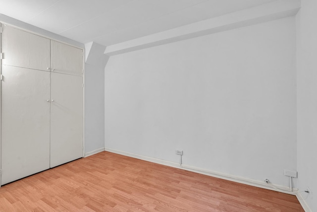7204 Oak Ave Unit 1Nw, River Forest, IL 60305 - unfurnished bedroom with light wood-style floors, a closet, and baseboards