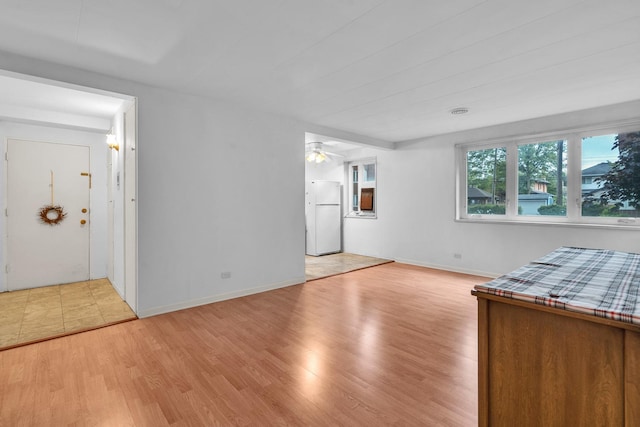 7204 Oak Ave Unit 1Nw, River Forest, IL 60305 - unfurnished living room with light wood finished floors, ceiling fan, and baseboards