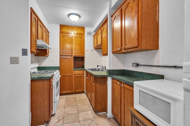 7204 Oak Ave Unit 1Nw, River Forest, IL 60305 - kitchen with white appliances, a sink, dark countertops, and brown cabinets