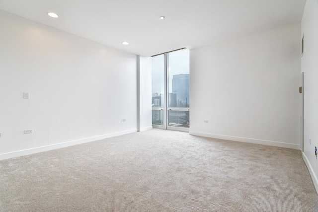 737 W Washington Blvd Unit 2702, Chicago, IL 60661 - carpeted spare room with expansive windows, baseboards, and recessed lighting