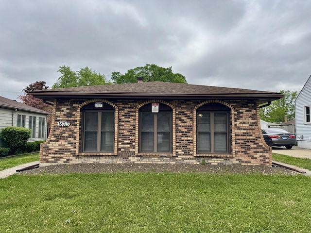 18013 Park Ave, Lansing, IL 60438 - view of front of property featuring brick siding, a front yard, and roof with shingles