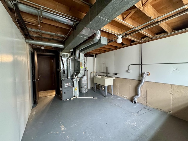 18013 Park Ave, Lansing, IL 60438 - unfinished basement featuring heating unit and water heater