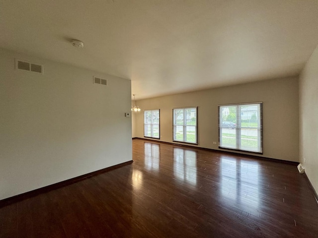 18013 Park Ave, Lansing, IL 60438 - spare room featuring a chandelier, wood finished floors, baseboards, and a smoke detector