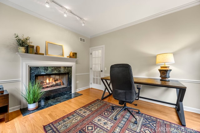 203 E Lincoln Ave, Wheaton, IL 60187 - office area featuring track lighting, a high end fireplace, wood finished floors, crown molding, and baseboards