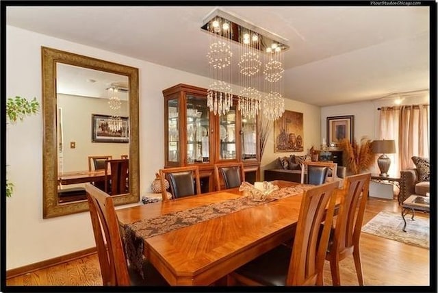 510 W Millns Ct, Addison, IL 60101 - dining space featuring a chandelier, wood finished floors, and baseboards