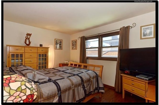 510 W Millns Ct, Addison, IL 60101 - bedroom featuring wood finished floors and baseboards
