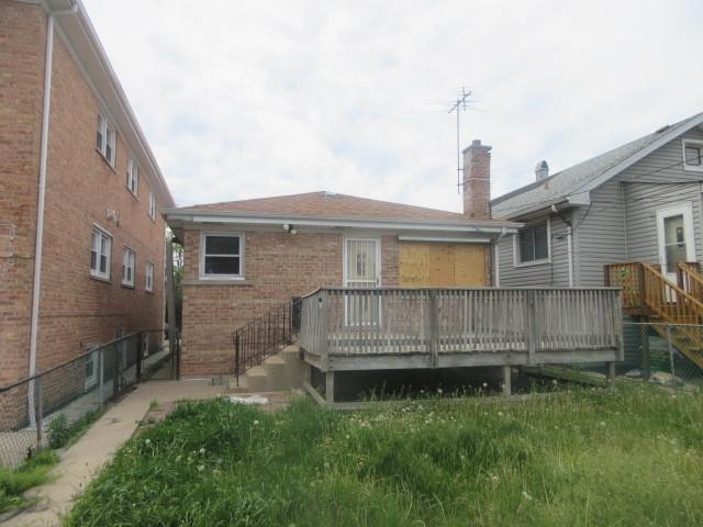 2311 N Natchez Ave, Chicago, IL 60707 - rear view of property with a wooden deck, brick siding, and a chimney