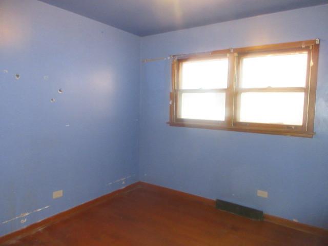 2311 N Natchez Ave, Chicago, IL 60707 - unfurnished room with baseboards and wood finished floors
